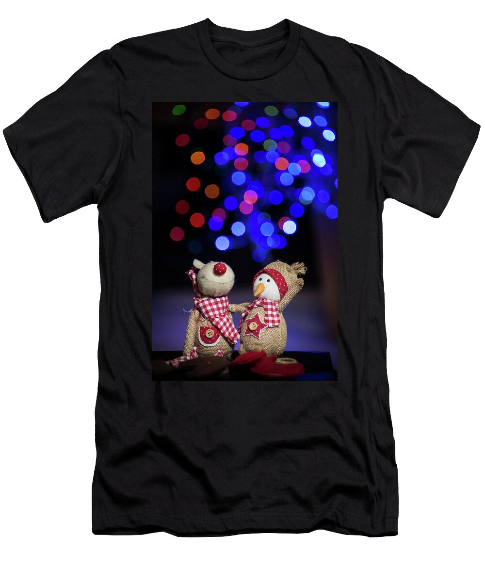 2 Christmas Figurine Toys on Colorful Bokeh Background Ognian Setchanov T-Shirt