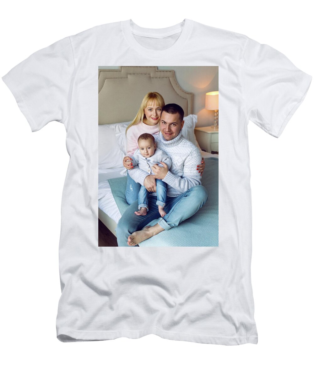 Family with Son Sitting on the Bed Elena Saulich T-Shirt