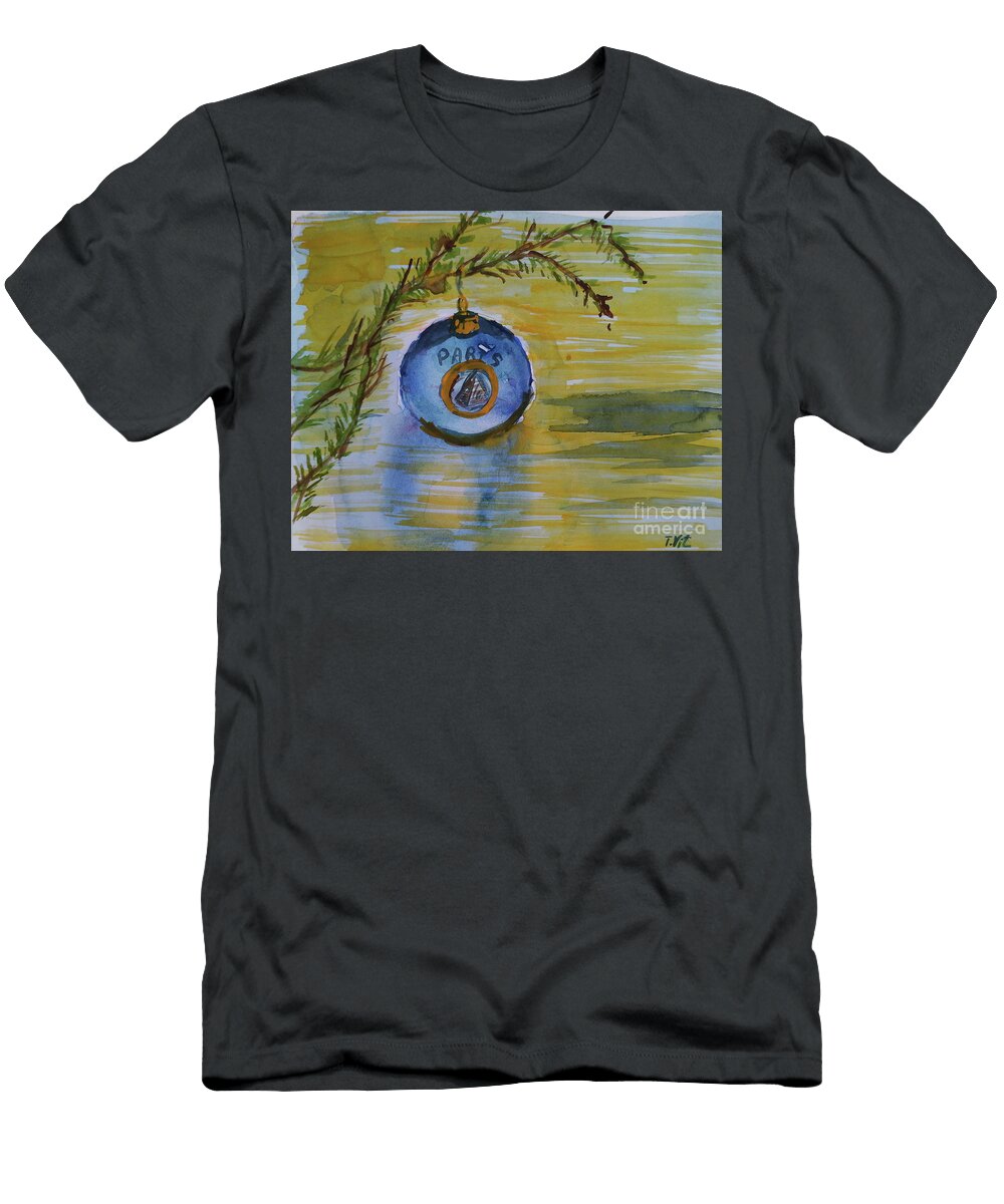 Happy Holidays Blue Christmas Ball on Yellow Table Paris Tamara Vitsenkova T-Shirt