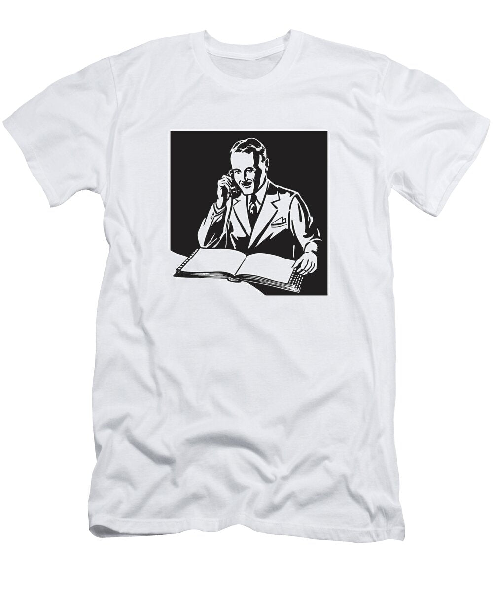 Man Looking At Book While on Phone Csa Images T-Shirt